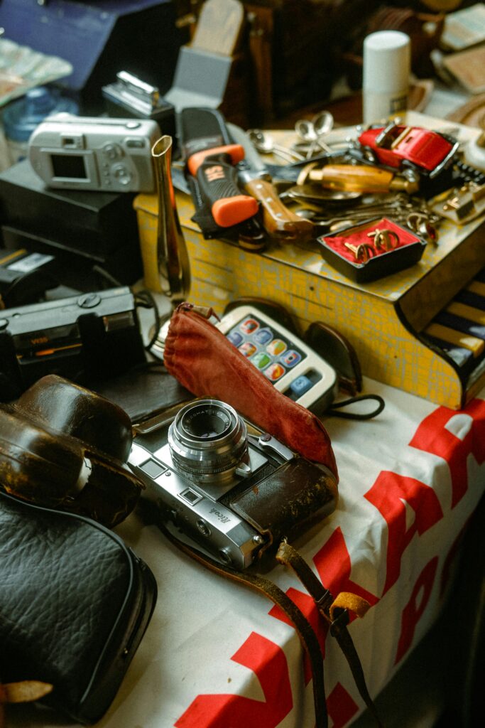 Table with vintage camera and retro gadgets, capturing nostalgic vibes.